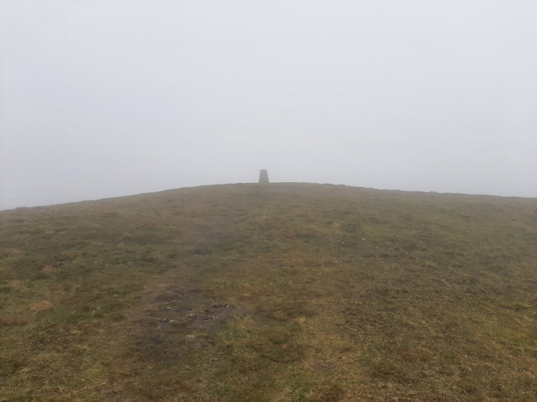 Trig point on Lank Rigg through the mist