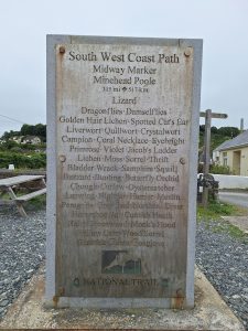 A steel and granite monument celebrating the half way point of the SWCP