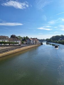 A wide river under a blue sky.