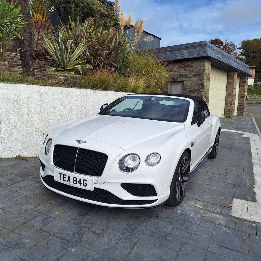 A white Bentley car with registration TEA 84G ('TEABAG')
